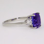 Platinum rectangular cushion cut tanzanite and round brilliant cut diamond ring side