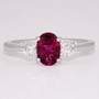 Platinum oval cut pink tourmaline and round brilliant cut diamond ring