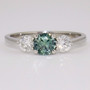 Platinum round cut green sapphire and round brilliant cut diamond ring