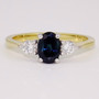 18ct gold oval cut teal sapphire and round brilliant cut diamond ring