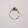 18ct gold oval cut emerald and round brilliant cut diamond ring top