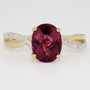 9ct gold oval cut raspberry garnet and diamond ring