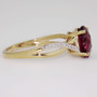 9ct gold oval cut raspberry garnet and diamond ring side