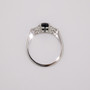 Platinum round cut teal sapphire and round brilliant cut diamond ring top