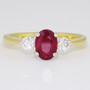 18ct gold and platinum oval cut ruby and round brilliant cut diamond ring