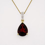 9ct gold pear cut garnet pendant with diamond-set bail