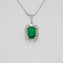 18ct white gold emerald and diamond cluster pendant