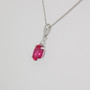 9ct white gold oval cut ruby and round brilliant cut diamond pendant side