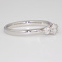 Platinum round brilliant cut diamond trilogy ring side