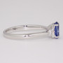 Platinum oval cut Ceylon sapphire and round brilliant cut diamond ring side