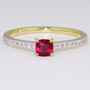18ct gold cushion cut ruby ring with round brilliant cut diamond-set shoulders