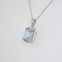 18ct white gold emerald cut aquamarine and diamond halo pendant side