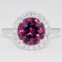 Platinum round cut malaya garnet and diamond halo ring