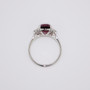 Platinum cushion cut malaya garnet and six graduated round brilliant cut diamond ring top