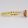 18ct gold and platinum oval cut orange sapphire and six round brilliant cut diamond ring side