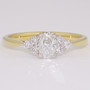 18ct gold and platinum ring with a certificated oval cut diamond and six round brilliant cut diamonds