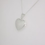 Sterling silver engraved heart-shaped locket side