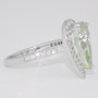 18ct white gold unheated pear cut green aquamarine and diamond halo ring with diamond-set shoulders side