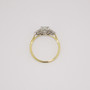 18ct gold and platinum ring with an oval cut certificated diamond and six round brilliant cut diamonds top