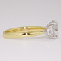 18ct gold and platinum ring with an oval cut certificated diamond and six round brilliant cut diamonds side