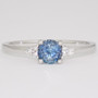Platinum round cut aquamarine and round brilliant cut diamond ring
