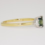 18ct gold oval cut teal sapphire and round brilliant cut diamond ring side