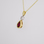 18ct yellow and white gold pear cut ruby and round brilliant cut diamond pendant side