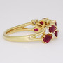 18ct gold pear cut ruby and round brilliant cut diamond ring side