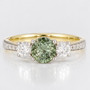 18ct gold and platinum round cut green sapphire and round brilliant cut diamond ring with diamond-set shoulders