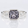 Platinum rubover-set radiant cut grey spinel and pear cut diamond ring