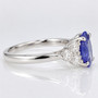 Platinum oval cut Ceylon sapphire and round brilliant cut diamond ring side