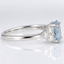 Platinum oval cut aquamarine and round brilliant cut diamond ring side
