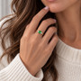 18ct and platinum cushion cut tsavorite garnet and round brilliant cut diamond ring on hand