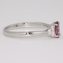 Platinum oval cut raspberry sapphire and round brilliant cut diamond ring side