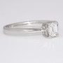 Platinum emerald cut diamond ring side
