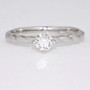 Platinum diamond solitaire ring with twisted band