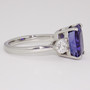Platinum cushion cut sapphire and round brilliant cut diamond ring side