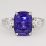 Platinum cushion cut sapphire and round brilliant cut diamond ring