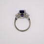 Platinum cushion cut sapphire and round brilliant cut diamond ring top