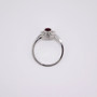 18ct white gold oval cut ruby and round brilliant cut diamond cluster ring top