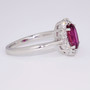 18ct white gold oval cut ruby and round brilliant cut diamond cluster ring side