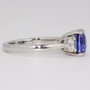 Platinum cushion cut unheated sapphire and diamond three stone ring