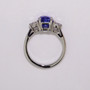 Platinum cushion cut unheated sapphire and diamond three stone ring