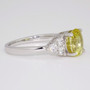 Platinum unheated oval cut yellow sapphire and round brilliant cut diamond ring side