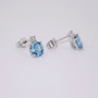 9ct white gold blue topaz and diamond stud earrings side