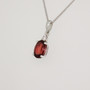 9ct white gold oval cut garnet and diamond pendant side