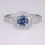 Platinum aquamarine and diamond halo ring