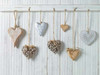 Hearts hanging on wooden background Poster Print by  Assaf Frank - Item # VARPDXAF20141122022