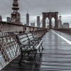 Empty bench on the pedestrian walkway of the Brooklyn Bridge, New York Poster Print by  Assaf Frank - Item # VARPDXAF20131116302C03