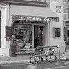 le Panini Cafe Poster Print by Alan Blaustein